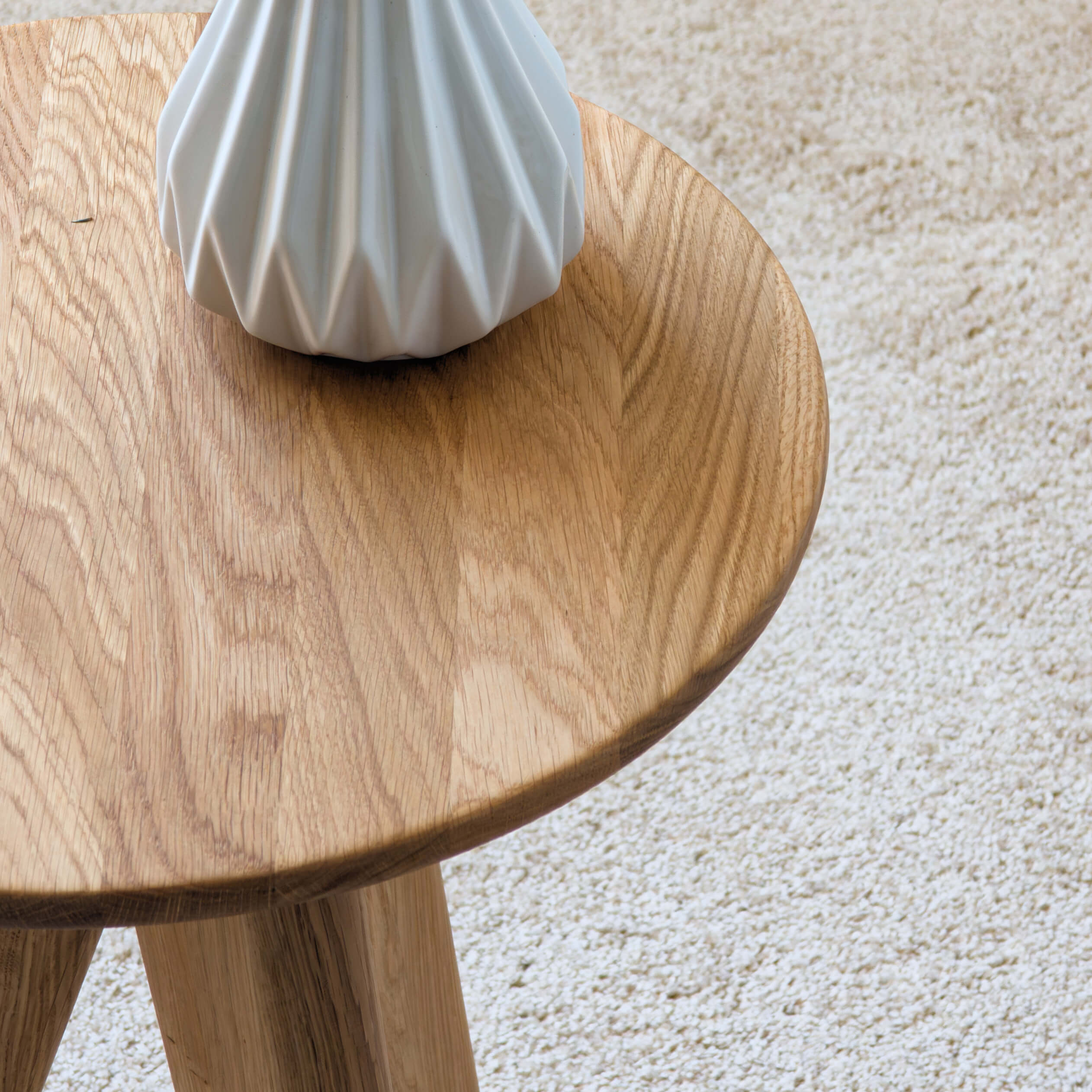 Close-up of solid oak wood texture on handcrafted side table